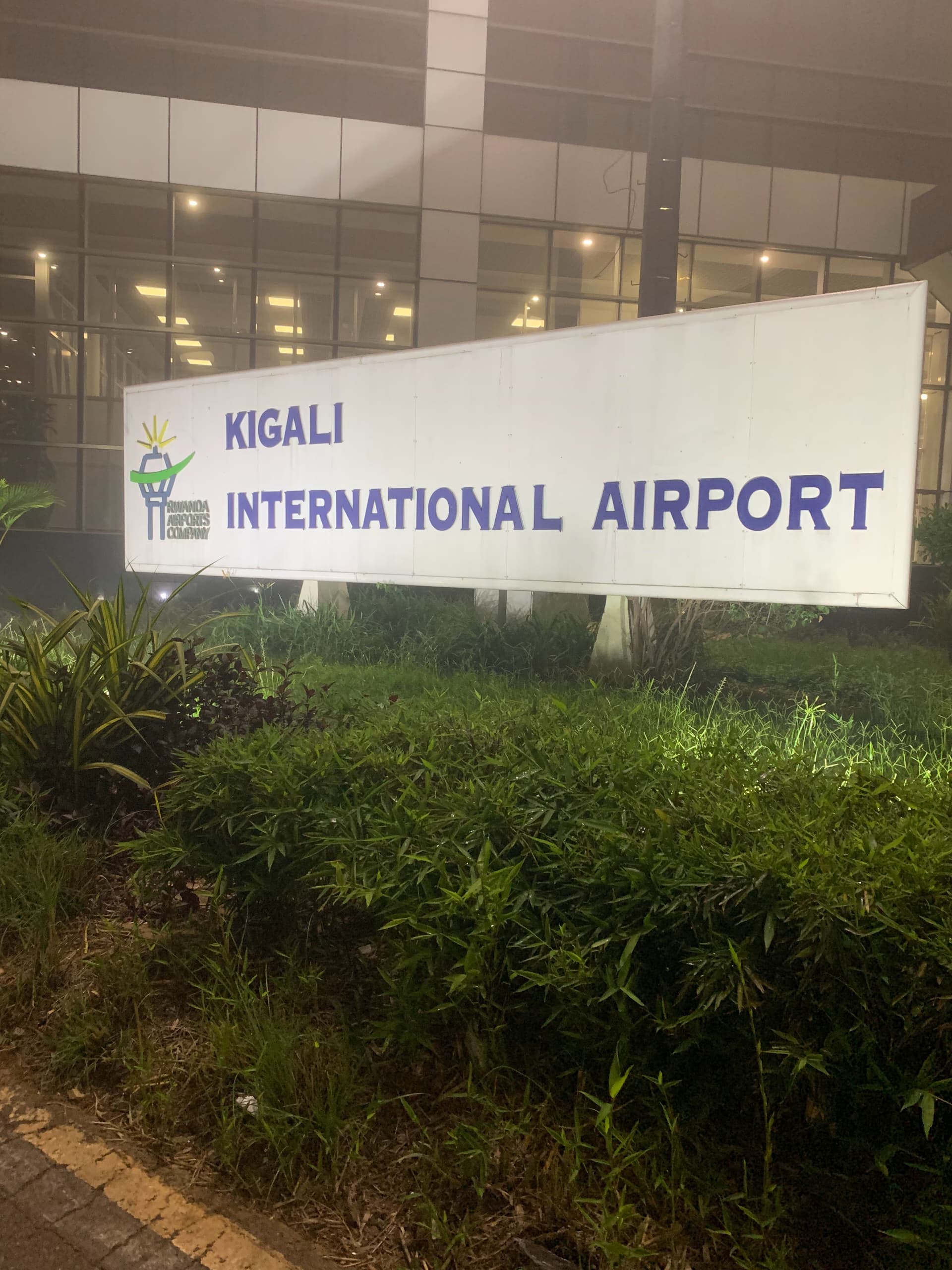 Kigali International Airport sign at the modern terminal building