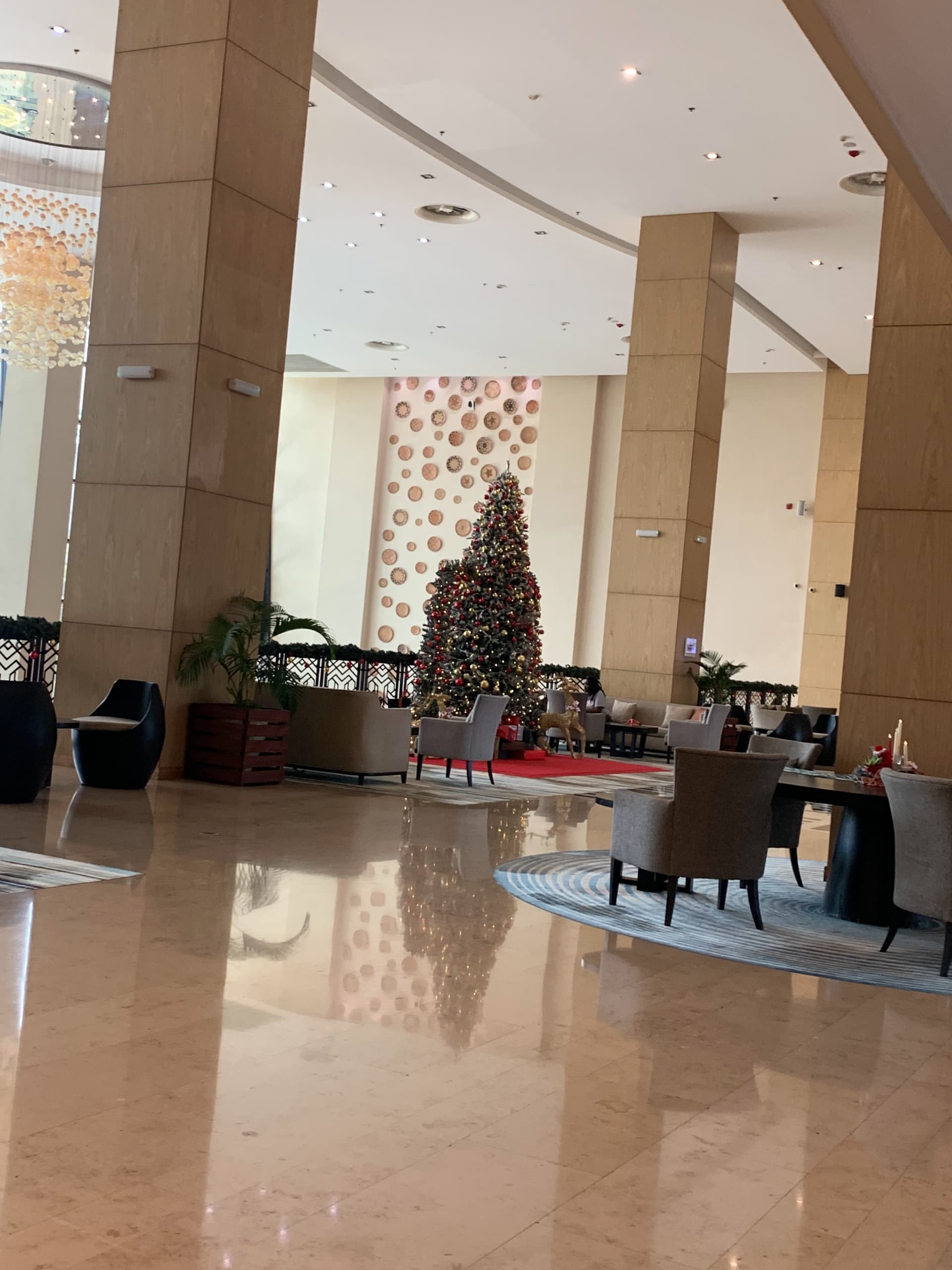 Elegant hotel lobby with Christmas decorations and modern architecture