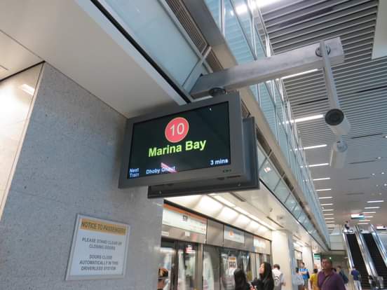 Marina Bay MRT station sign showing efficient public transportation system