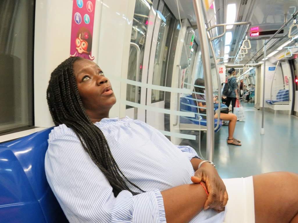 Anike riding the ultra-modern MRT (Mass Rapid Transit) system in Singapore